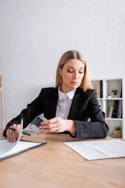 Blonde Lawyer Formal Wear Holding Stamper Pen While Looking Documents — Stock Photo, Image