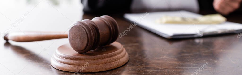 close up view of wooden judge gavel on desk, banner