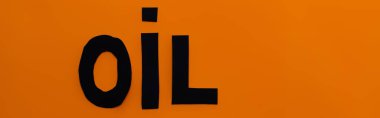 Top view of paper oil word on orange background, banner  clipart