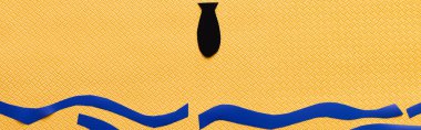 Soyut denizin üzerinde sarı arkaplanda siyah kağıt bombanın üst görüntüsü, afiş 
