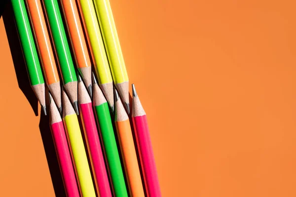Top View Colorful Pencils Orange Background — стоковое фото