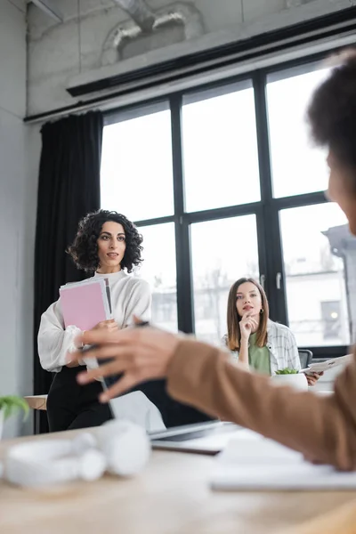 Interracial Businesswomen Papers Looking Blurred African American Colleague Office — Stock fotografie