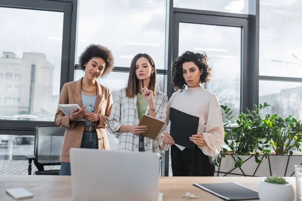 Multicultural Businesswomen Documents Notebook Looking Laptop Office — Foto de Stock