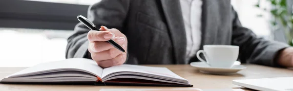 Cropped View Banker Holding Pen Notebook While Sitting Coffee Cup — Stock Photo, Image