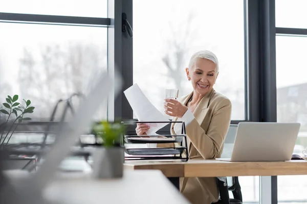 Successful Banker Documents Glass Water Smiling Online Conference Laptop — Fotografia de Stock