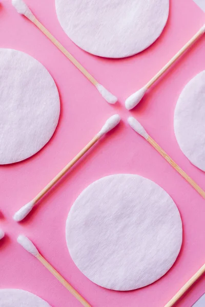 Close Ear Sticks Cotton Pads Pink Background Top View — Stok fotoğraf