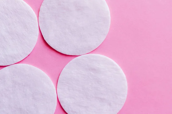 Close White Cotton Pads Pink Background Top View — 스톡 사진