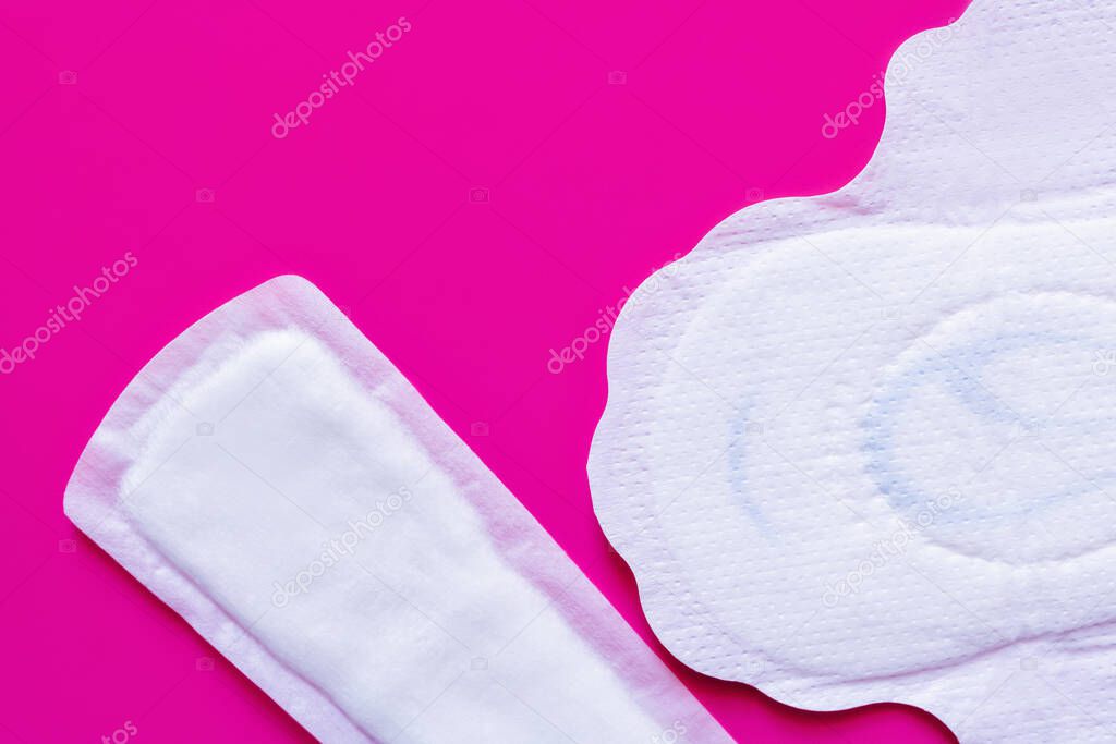 top view of different panty liners on purple background