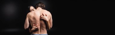 Passionate woman scratching back of muscular man on black background, banner  clipart