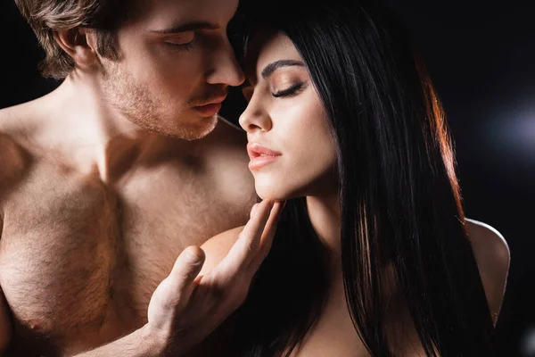 Shirtless Man Touching Chin Brunette Girlfriend Black Background — Stock Photo, Image
