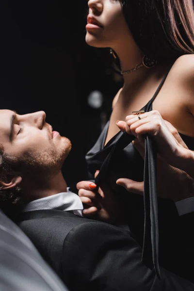 Passionate Woman Taking Dress Boyfriend Suit Black Background — Zdjęcie stockowe