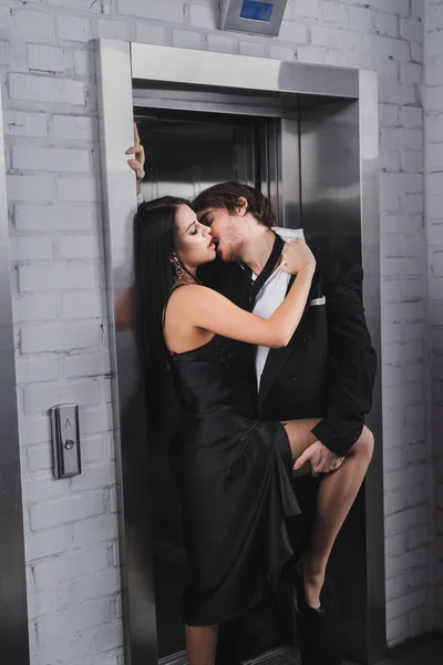 Passionate Woman Dress Undressing Boyfriend Elevator — стоковое фото