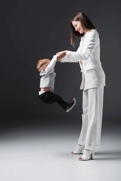 Side View Cheerful Woman Raising Little Son While Having Fun — Stock Photo, Image