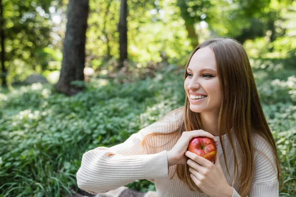 Cheerful Woman Holding Red Tasty Apple Green Park — 스톡 사진