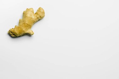 Top view of organic ginger on white background with copy space  clipart
