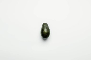 Top view of organic avocado on white background  clipart