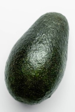 Close up view of green avocado on white background 