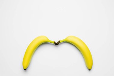 Top view of fresh bananas on white background 