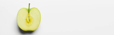 Top view of cut fresh apple on white background, banner 