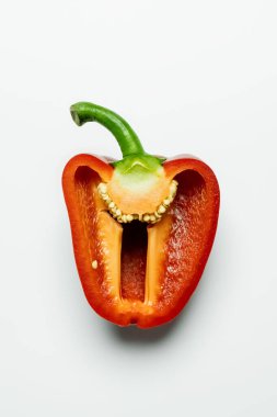 Top view of red cut bell pepper on white background