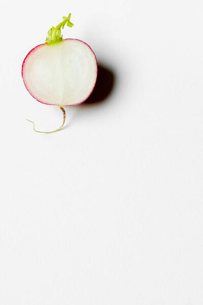 Top view of ripe cut radish on white background with copy space