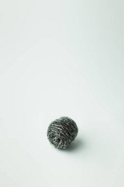 stainless steel scourer on grey background with copy space clipart