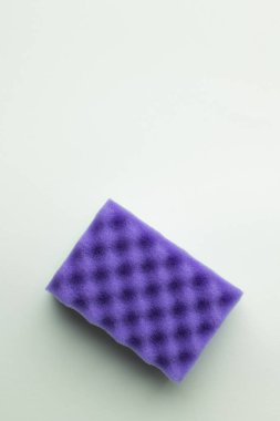 top view of bright purple sponge on grey background clipart