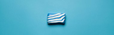top view of blue and white bath soap on blue background, banner clipart