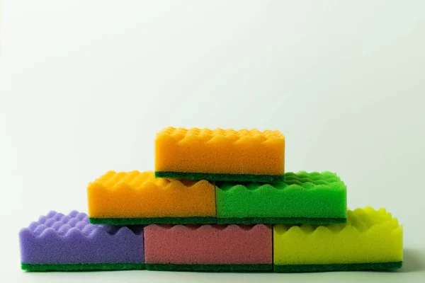 Multicolored Sponge Scourers Stacked Grey Background — стоковое фото