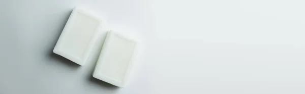 Top View Two Soap Bars Grey Background Copy Space Banner — стоковое фото