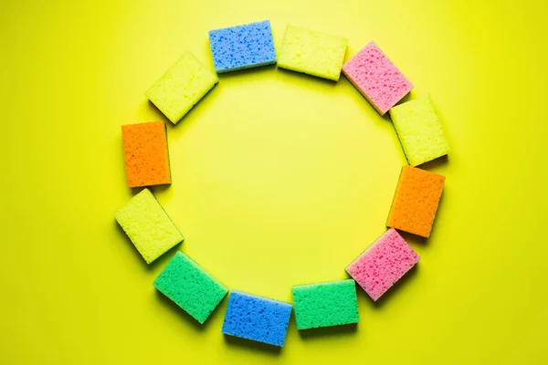 Top View Circle Frame Made Multicolored Sponges Yellow Background — Stockfoto