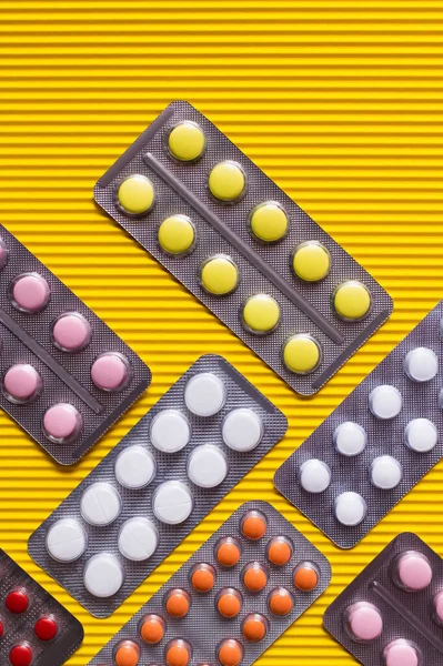 Top View Blister Packs Different Colorful Pills Yellow Textured Background — Stock Fotó