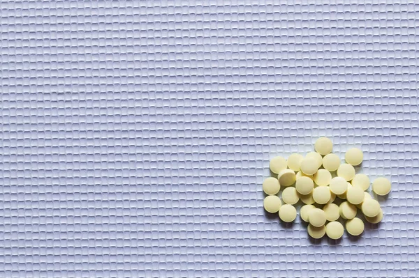Top View Pile Yellow Shape Pills White Textured Background — Stock Photo, Image
