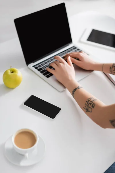 Partial View Tattooed Woman Typing Laptop Devices Blank Screen Apple — Stockfoto