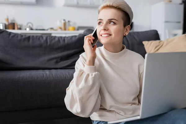 Cheerful Woman Looking Away While Talking Smartphone Laptop — 图库照片