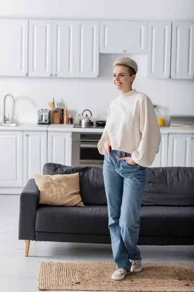 Full Length Trendy Woman Posing Hands Pockets Jeans Open Plan — стоковое фото
