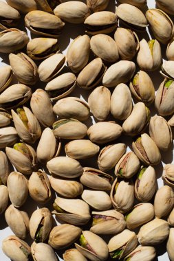top view of cracked organic and salty pistachios 