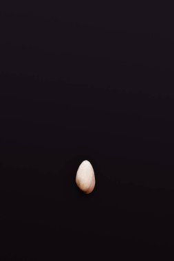 top view of pistachio in nutshell isolated on black 