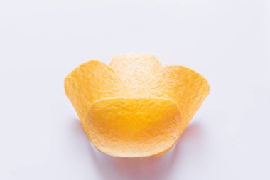 close up of salty potato chips on white background 