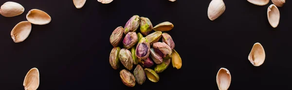 Top View Nutshells Salty Pistachios Isolated Black Banner — стоковое фото