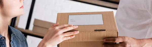 Cropped View Interracial Sellers Holding Carton Box Shipping Label Online — Stock Photo, Image