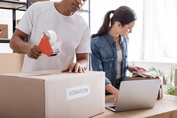 Multiethnic Sellers Packaging Boxes Donation Lettering Laptop Online Web Store — Stock Photo, Image