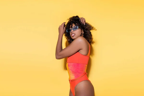 Stylish African American Woman Red Swimsuit Touching Curly Hair Looking — Stock Photo, Image