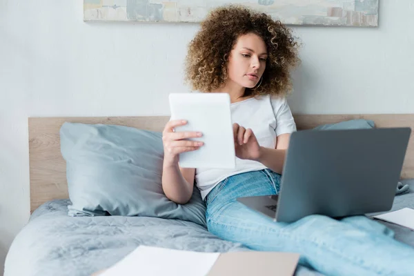 Young Curly Woman Working Digital Tablet Laptop Bed Home — Stock Photo, Image