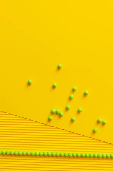 Top View Green Beads Scattered Yellow Textured Background — Stock Photo, Image