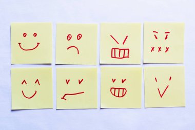top view of sticky notes with positive and negative smileys on white background clipart