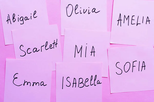 Top View Sticky Notes Different Female Names Violet Background — Stock Photo, Image