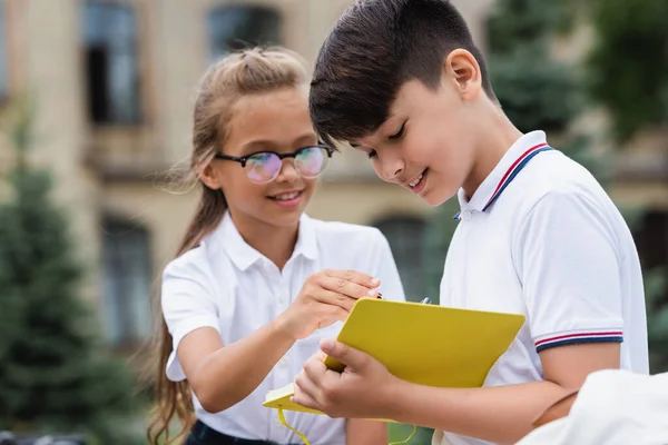 Asian Boy Holding Notebook Blurred Classmate Eyeglasses Park — Stock Photo, Image