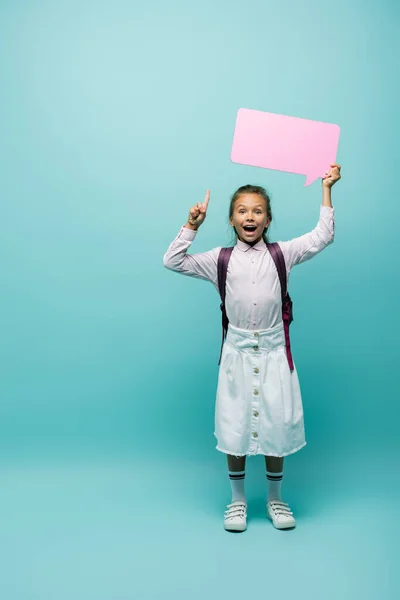 Excited Schoolgirl Holding Speech Bubble Having Idea Blue Background — Stock Photo, Image