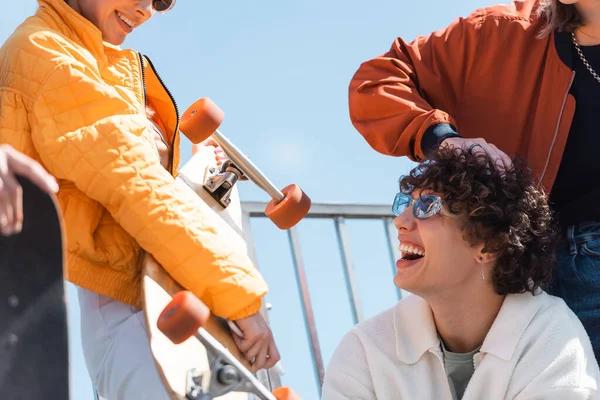 Curly Man Trendy Sunglasses Smiling Woman Longboard Outdoors — Stock Photo, Image